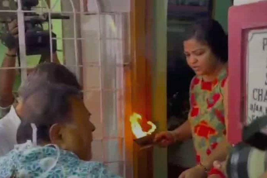 Surgical mask on face. Wearing a sky blue floral printed shirt. Hair condition is messy. After three long years and three and a half months in jail