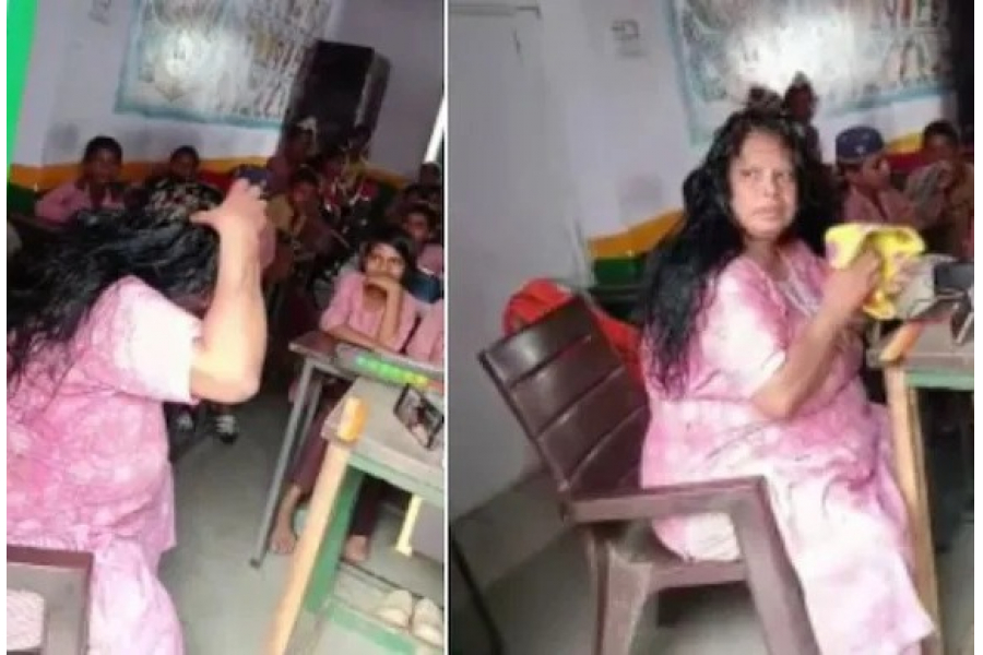 Playing music on the speaker in front of the students while the teacher applies oil to her hair...
